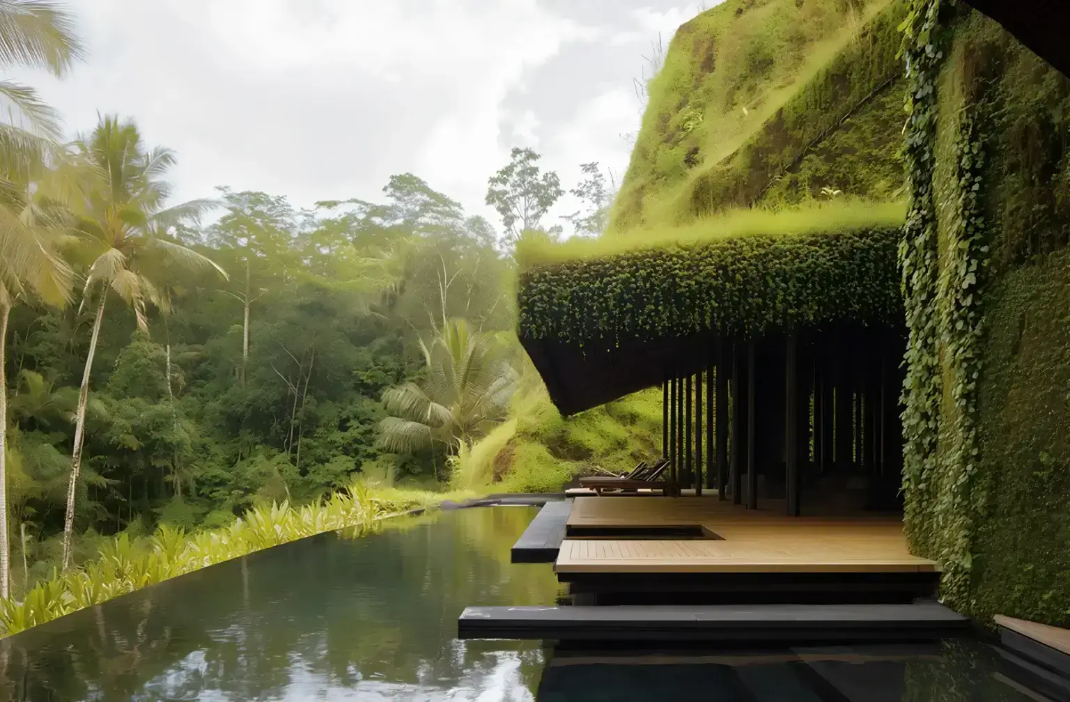 Sustainable building with living green roof, vertical plant walls, and infinity pool integrated into a tropical rainforest hillside
